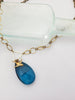 A Little Birdie Told Me So Crystal Necklace in Azure and Brass