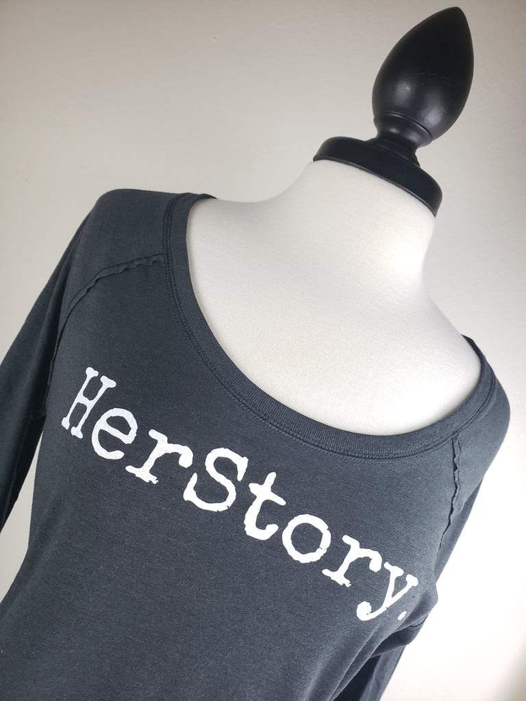 HerStory. Long Sleeved Tee in Graphite + White Lettering