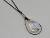 Hope Rising – Crystal Necklace in Brass and Northern Lights